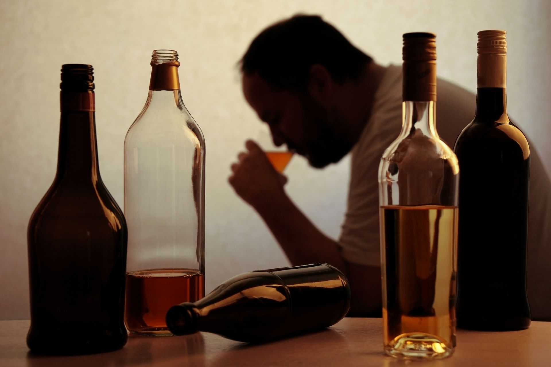 An alcholoic man drinking