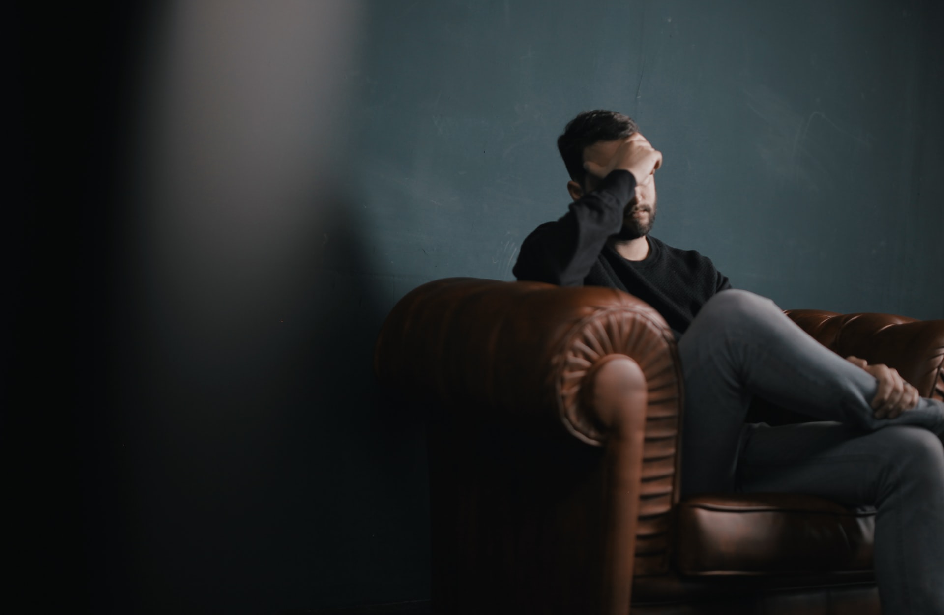 Anxious man sitting in a chair